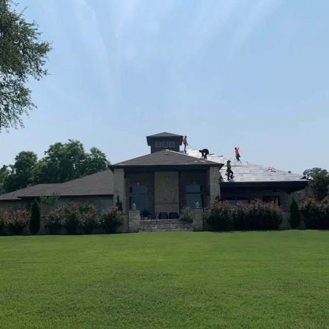 Roof replacement in process on a suburban house in Texas.